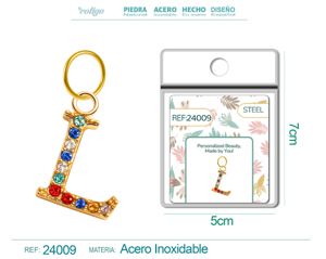 Charm de letra L de acero dorado con circonita